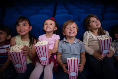 Mathaeser, Group of kids at the cinema looking very happy, mathaser, Mein erster Kinobesuch // München mit Kind